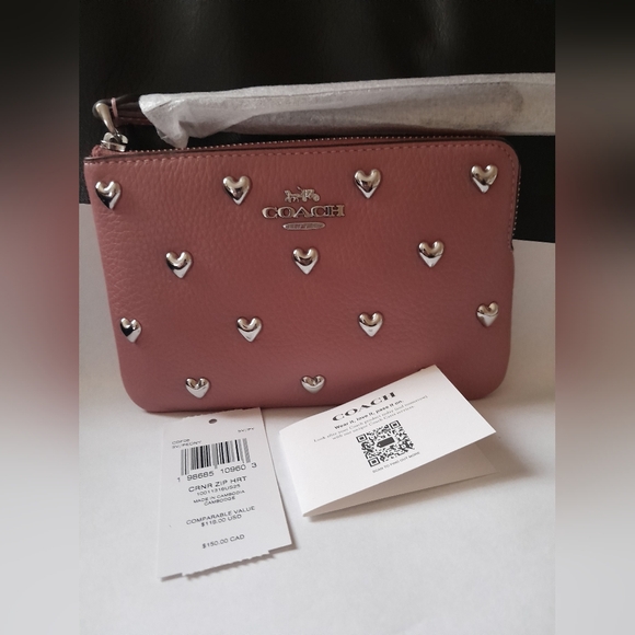 Coach Handbags - New Coach Wristlet With Hearts Rivets New With Tags In Peony Color 💕